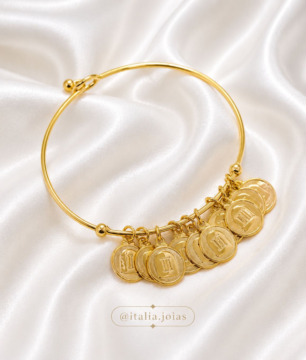 Pulseira aro em banho de ouro com medalhas